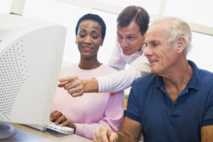 Mature students learn computer skills Mature students learn computers